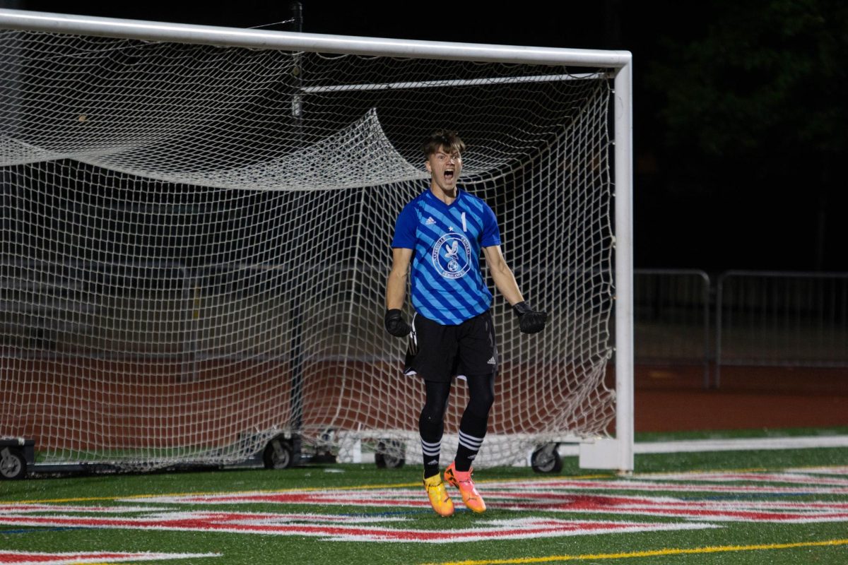 Central goalkeeper Connor Waite, a senior, celebrates during a game against Bartlett on Sept. 3. The game ended in a 1-1 tie. The Redhawks have started their season with a 4-1-3 record.