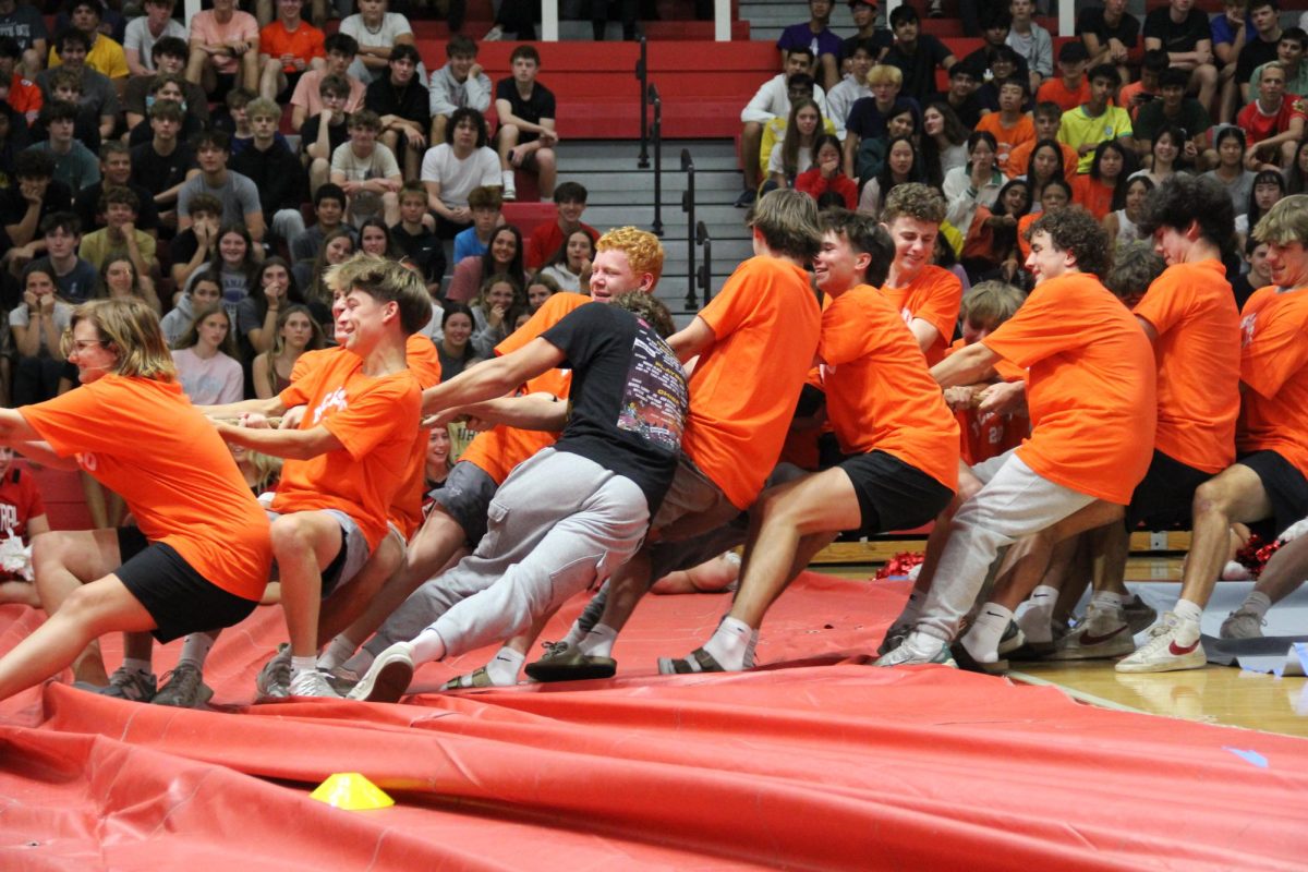 Juniors compete in tug-a-war during the homecoming kickoff assembly on Monday, Sept. 16. The assembly featured Olympics and Greece-themed class contests in honor of the homecoming theme "Vacation to Greece."