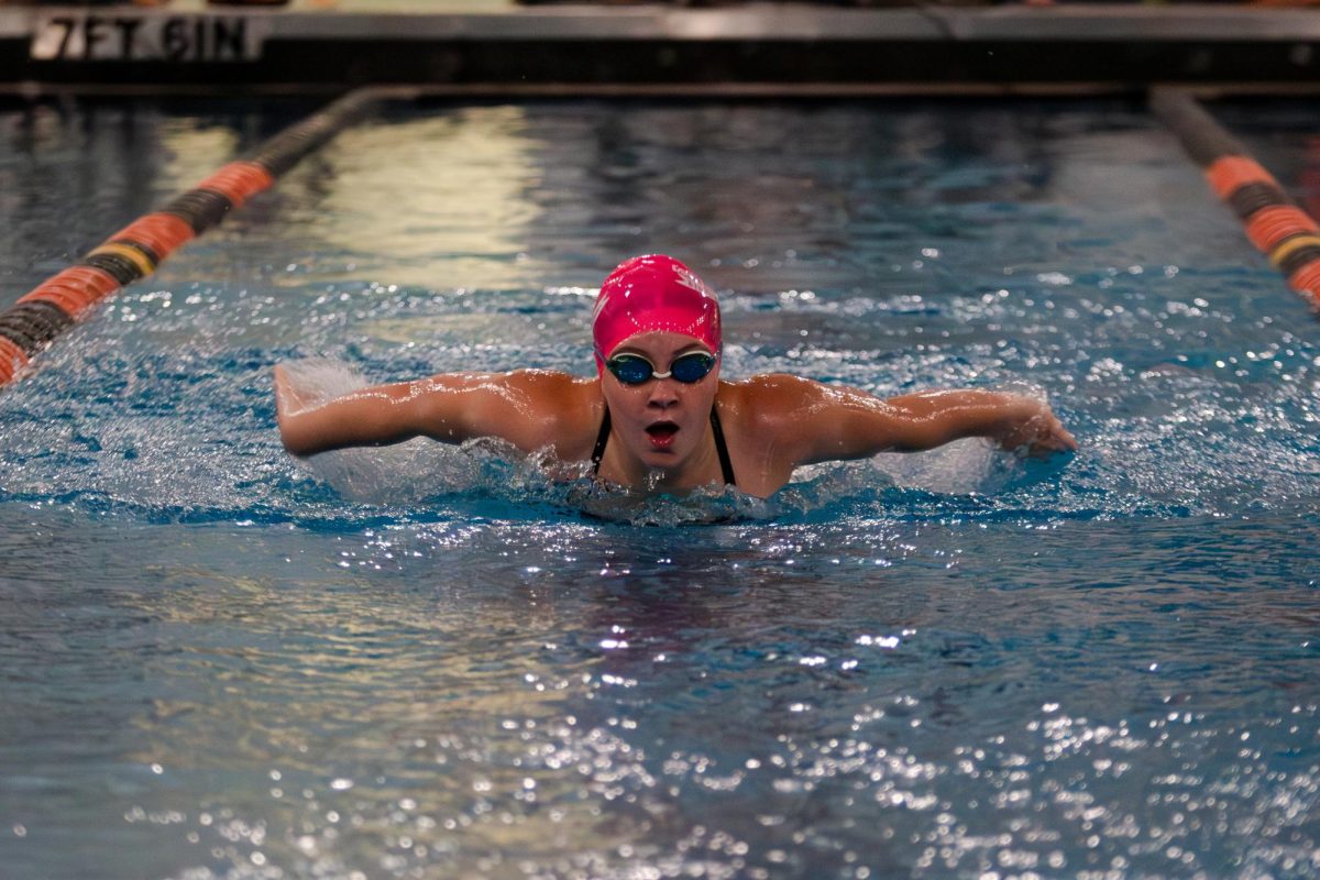 Freshman Kristi Powers swims butterfly during Naperville Central's meet against Naperville North on Sept. 17. The Redhawks walked away from the pool with a 127-75 win over the Huskies.