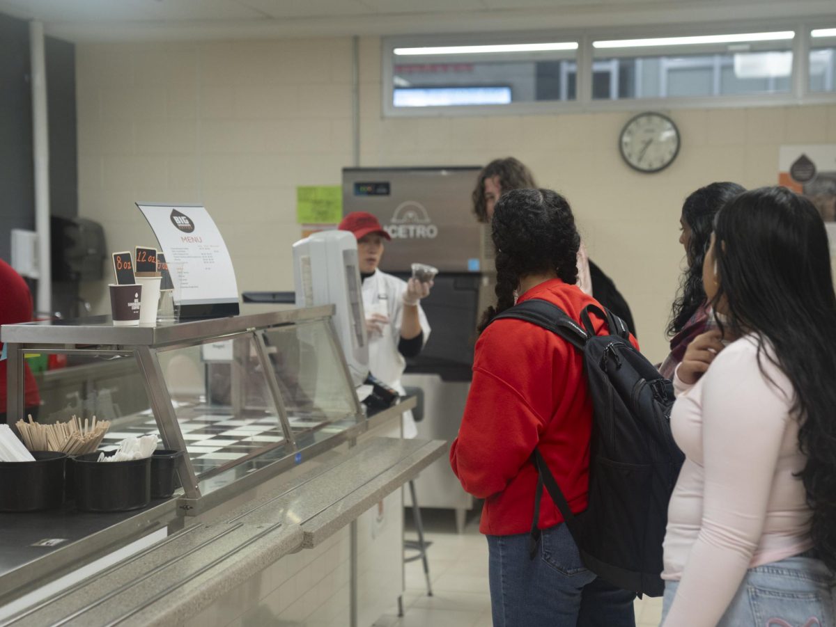 Students wait in line to order from Central's in-house coffee shop. It's located across from the main cafeteria’s serving lines, which was previously the faculty cafeteria.