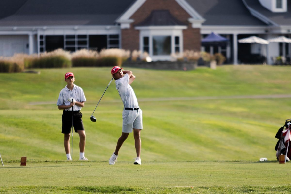 Senior and captain Alex Ung hits a drive during Central’s 13-6 loss to Naperville North on Sept. 19. The team came seventh in the Blackberry Oaks IHSA Sectional on Monday, Oct. 7.