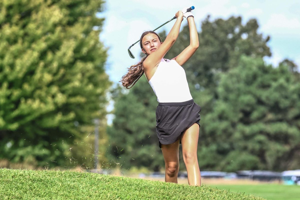 Sophomore Alexa Miller looks down the green at Naperbrook Golf Course on Aug. 28 at a match against Metea Valley. The Redhawks placed fourth at the DuPage Valley Championship. (Photo Credit: Lifetouch)