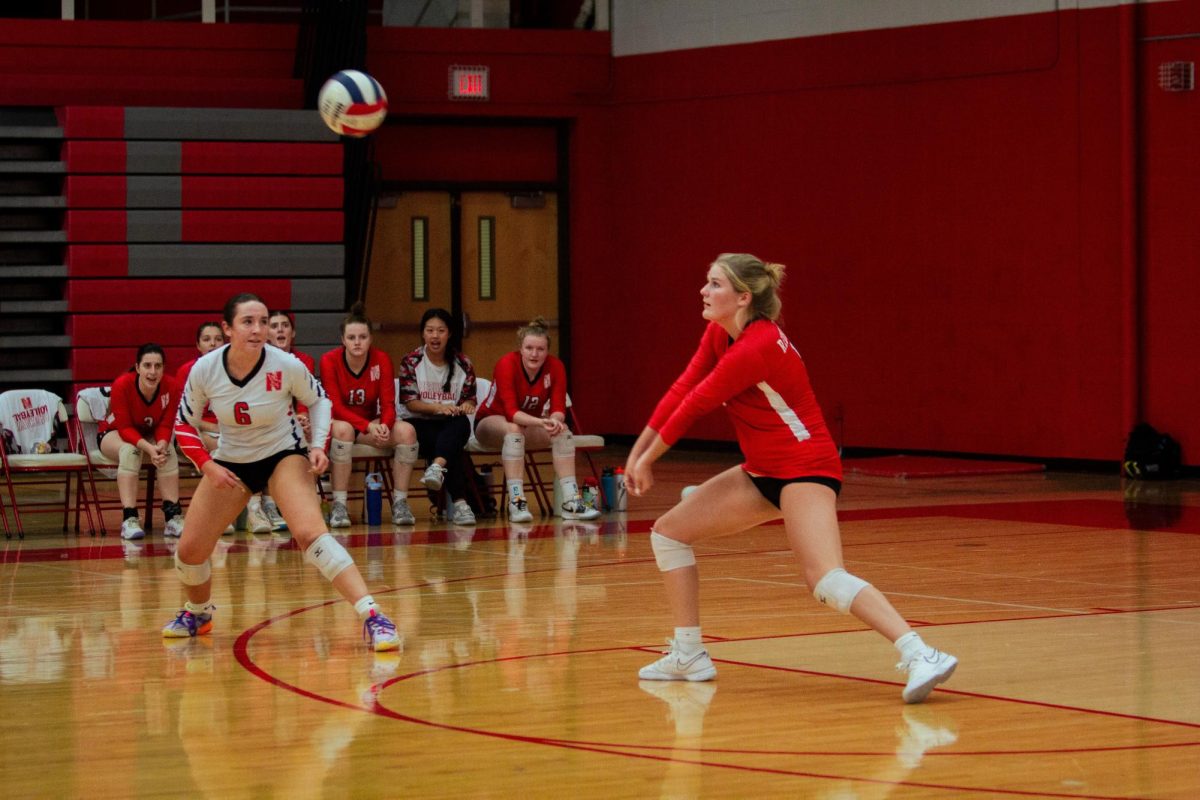 Senior Makenna Devick sets up to hit a ball in a match against Neuqua Valley on Sept. 24. The Redhawks won the match 2-0.