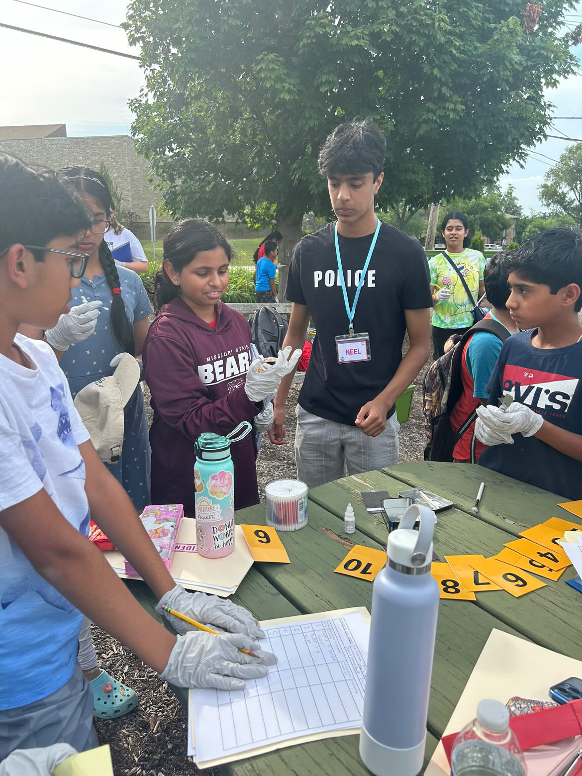 Students analyze forensics evidence during STEM Quest's hands-on criminology camp in June 2024. (Photo courtesy of Anushka Gulati)