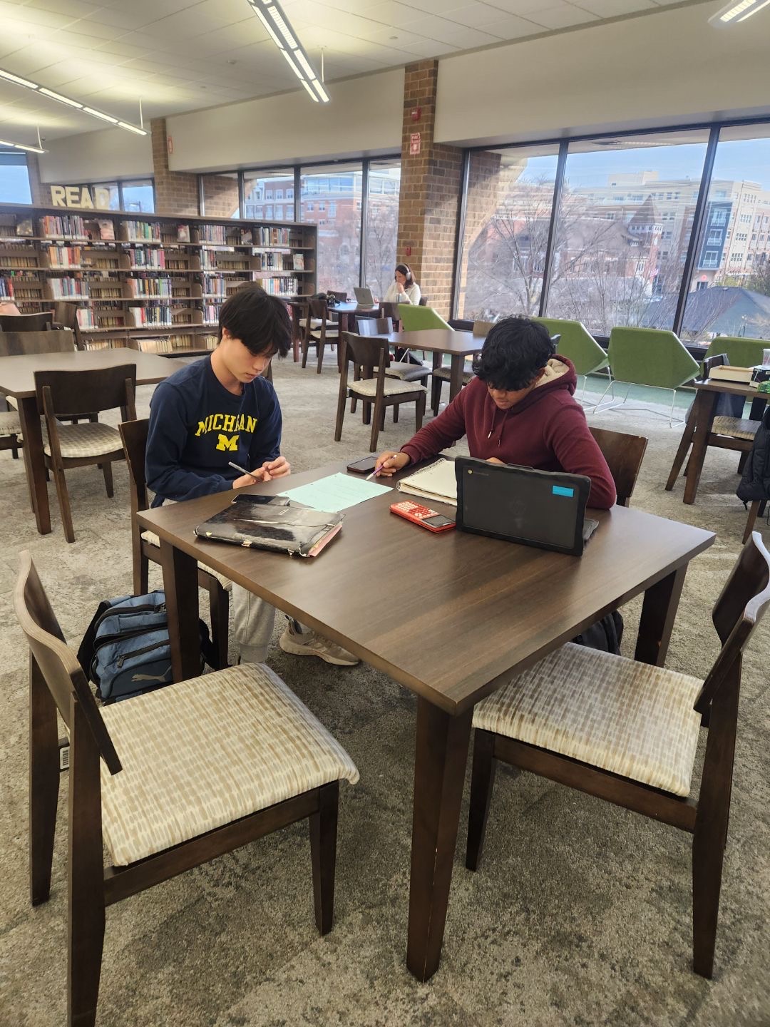 A student receives academic support from The Merry Tutor on Saturday, Nov. 16 at Nichols Library in Downtown Naperville.