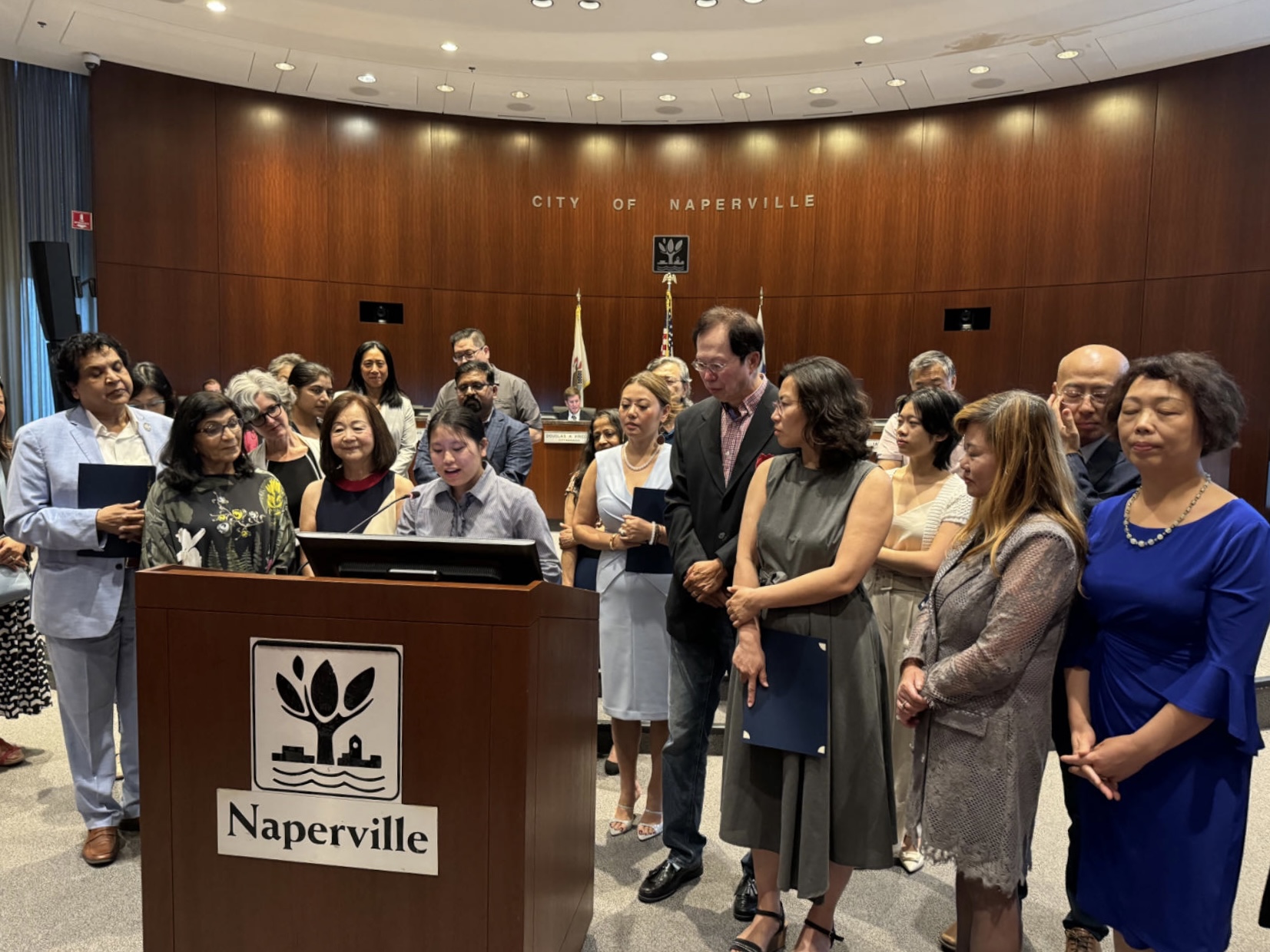 Junior Hannah Leong receives a proclamation from Naperville City Council during Asian-American and Pacific Islander Heritage month. (Photo courtesy of Hannah Leong)