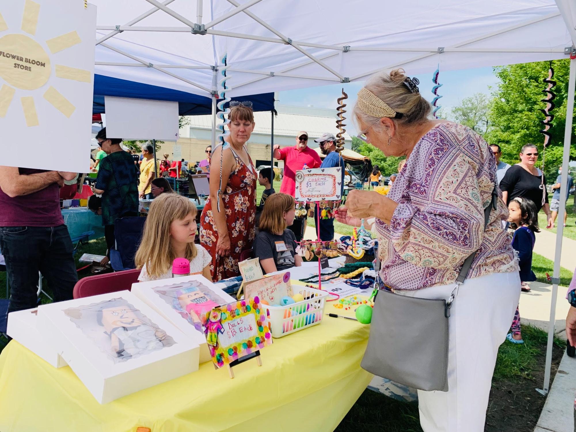 Customers walk the aisles of the  Naperville Children's Business Fair in August 2023. (Photo courtesy of Hiba Hasan)