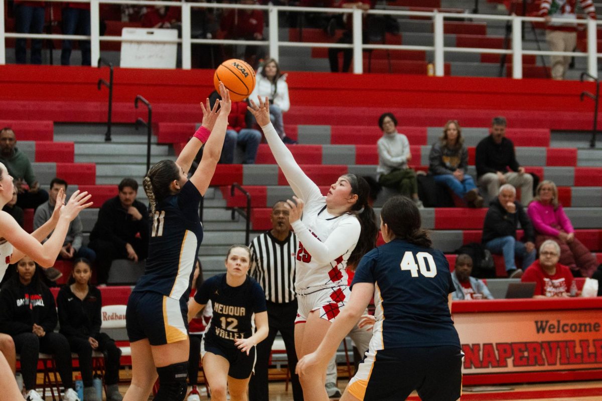 Junior Erin Hackett shoots a floater over Neuqua Valley during Naperville Central’s game on Dec. 6. Girls basketball has started the season 3-6, including their 59-51 loss to the Wildcats.