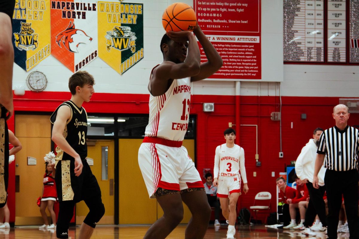 Junior Evan Moss shoots a free throw during the Redhawk’s game against Sycamore on Dec. 4. Central went on to lose the home opener in overtime by a score of 57-54.