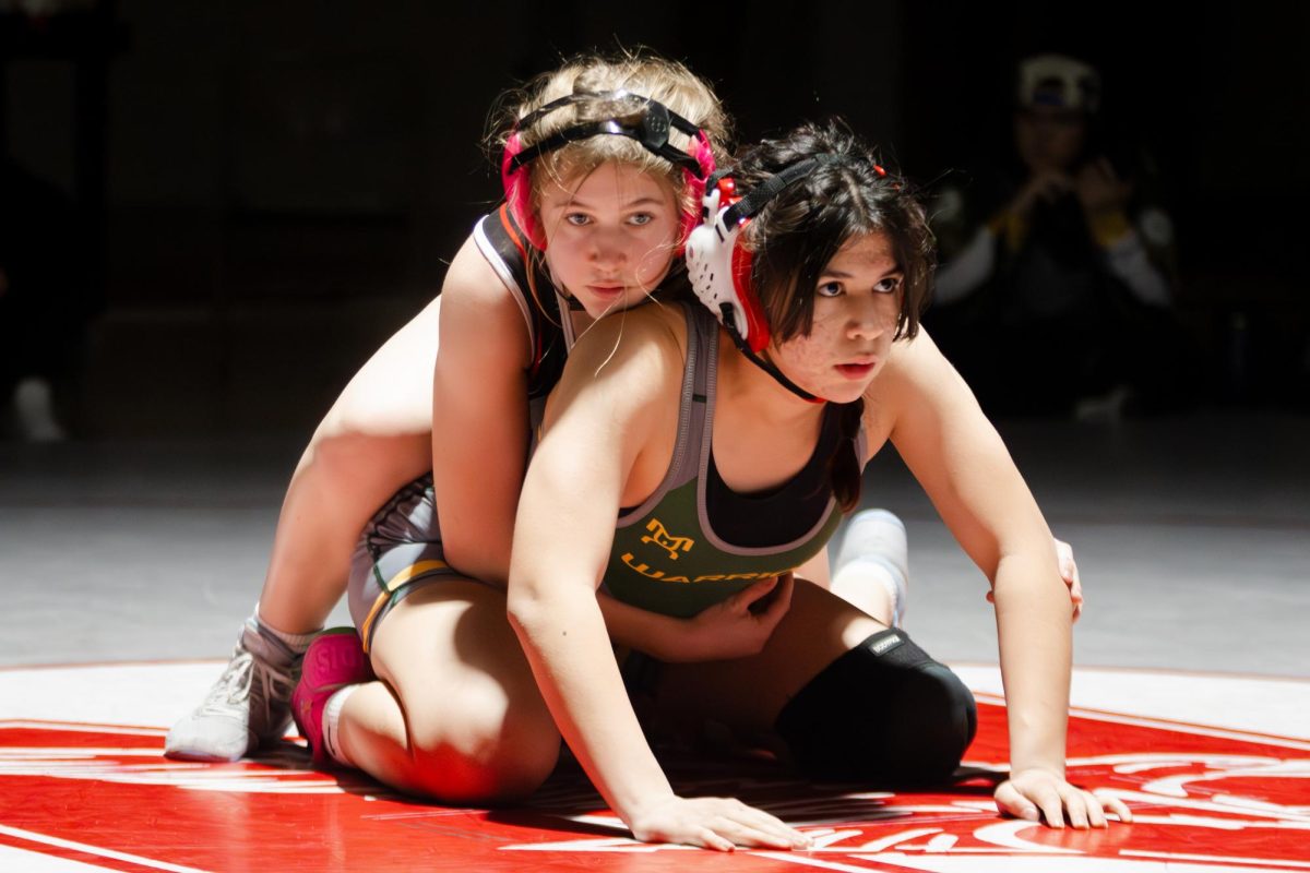 Senior Breanna Berkowitz wrestling on Jan. 16 against Waubonsie Valley during Senior Night. Berkowitz lost the match after being pinned.