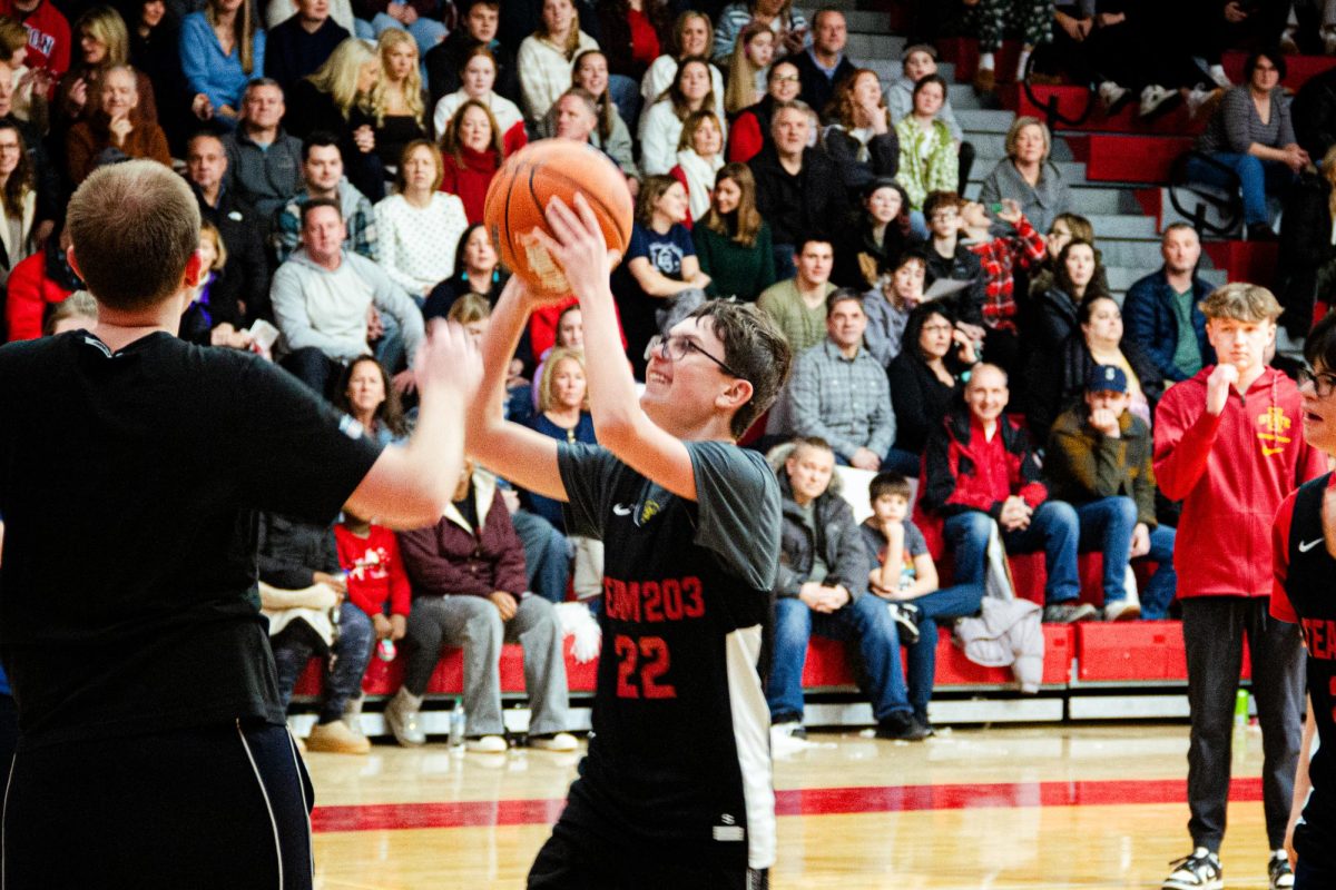 A Team 203 Fire athlete shoots for two points on Jan. 11 during the team's annual Pack the Gym event. The gathering brings together Special Olympics athletes from across the district in a scrimmage.