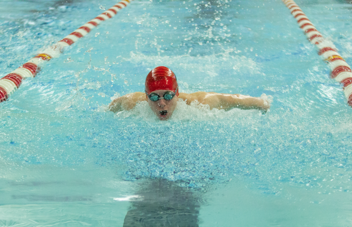 Sophmore Cody Zelazny swims butterfly during Naperville Central’s meet against Waubonsie Valley on Jan. 23. The Redhawks walked away from the pool with a 106-79 win over the Warriors. 