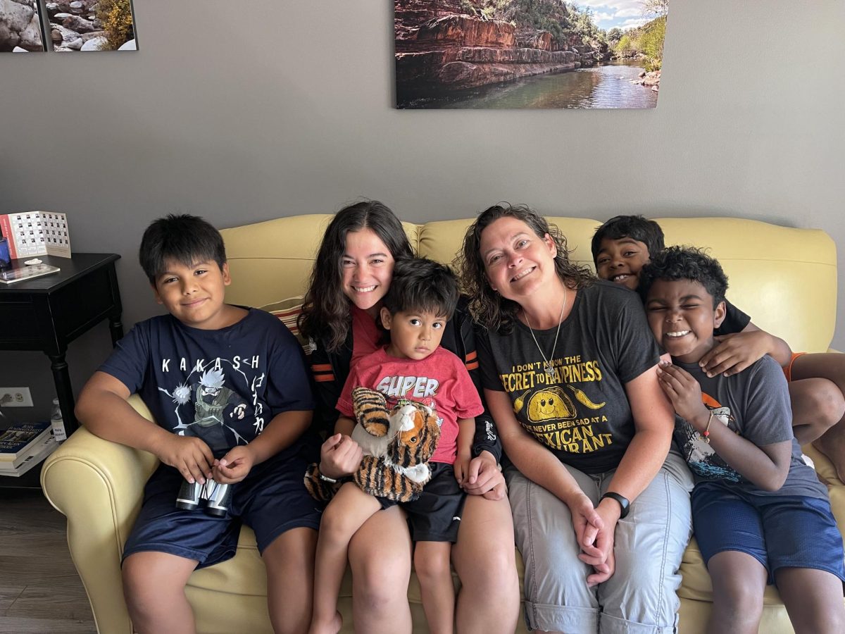 Kim Cancio (third from right) and her daughter Lauren Cancio (second from left) pose for a photo on June 27, 2022, with the family's four foster placements at the time. The Cancio family has been fostering children since 2019. (Photo credit: Kim Cancio) 
